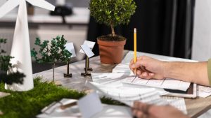 wp-content-uploads-2025-09-side-view-man-working-eco-friendly-wind-power-project-with-paper-plans-300x169
